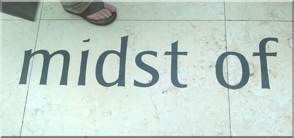 In midst of barefoot in sandal